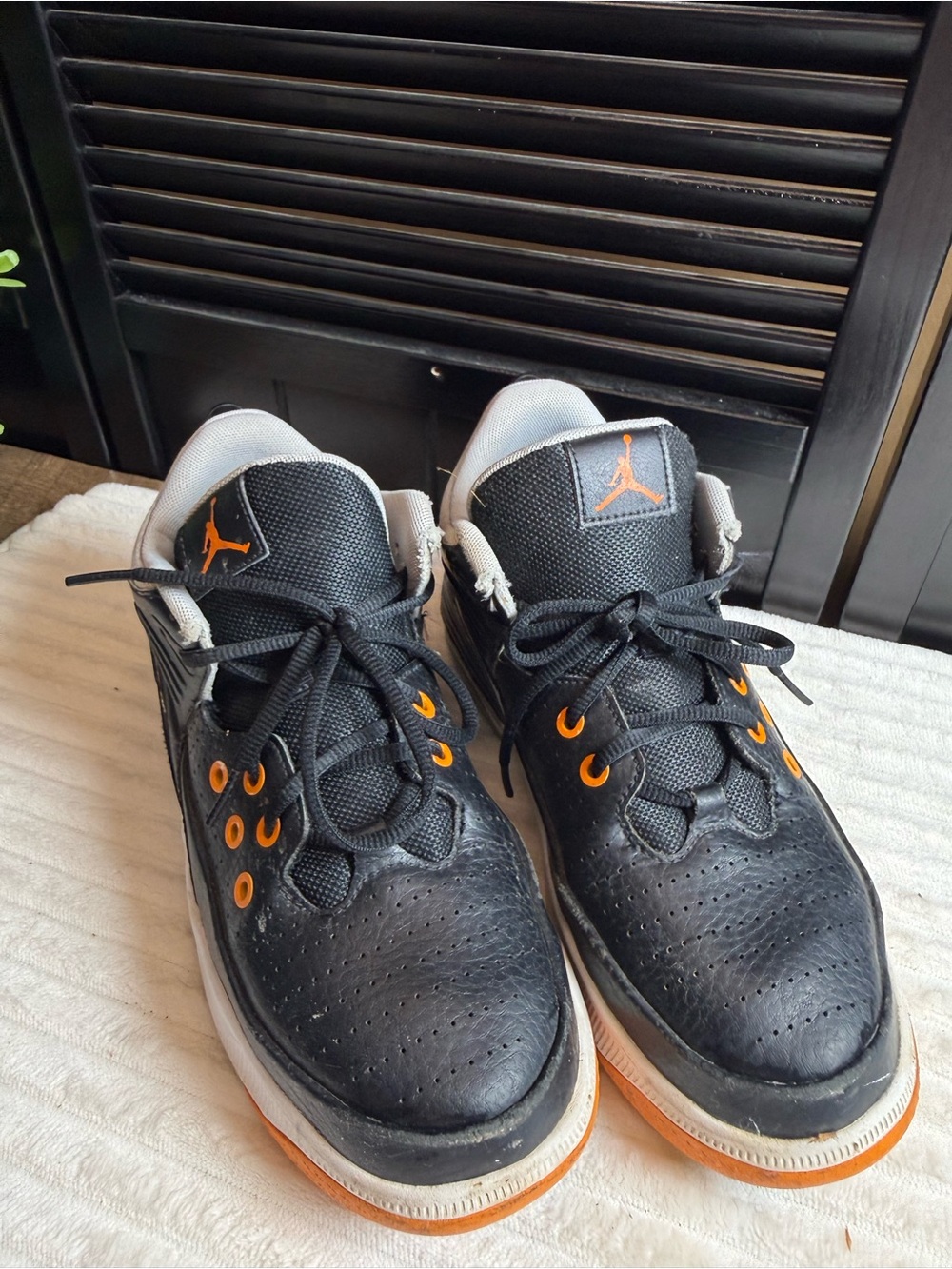 Jordan Black Sneakers with Orange Accents